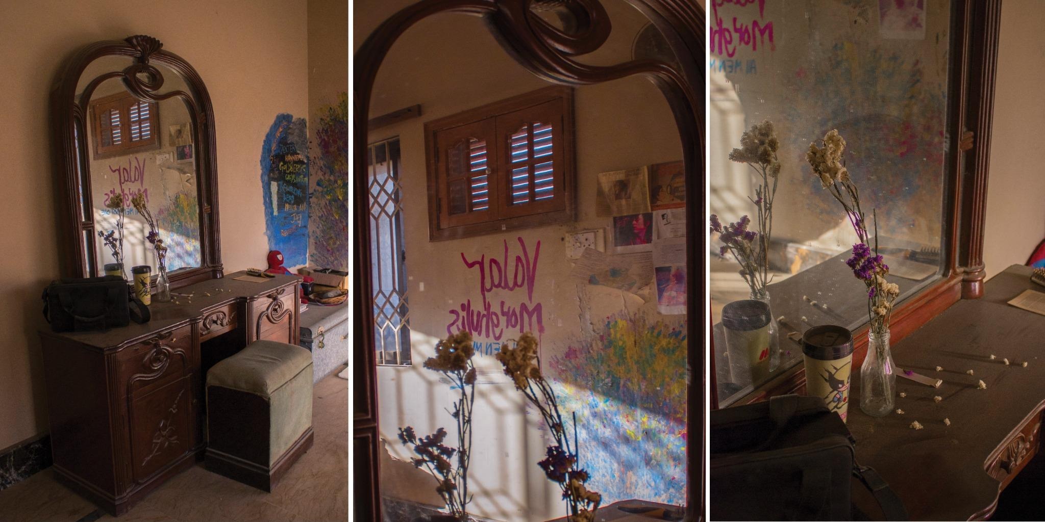 Triptych of a wooden dressing table and mirror, marker writing across the glass, dried flowers in a glass jar