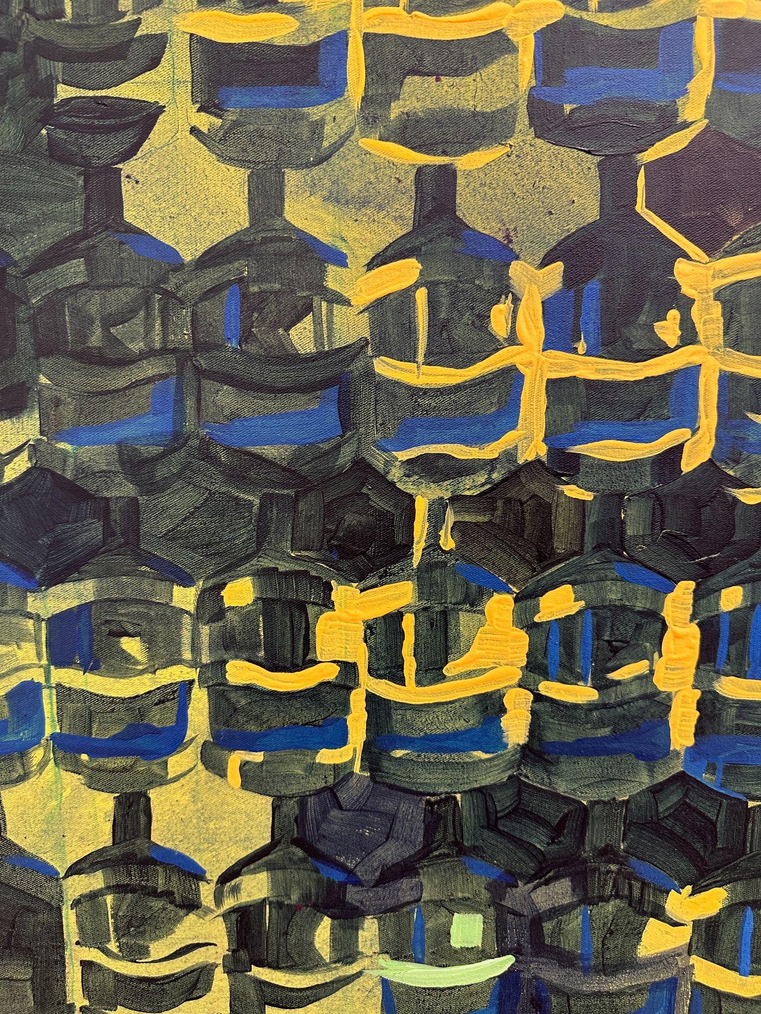 Detail: repeating geometric shapes in green, yellow and dark blue.